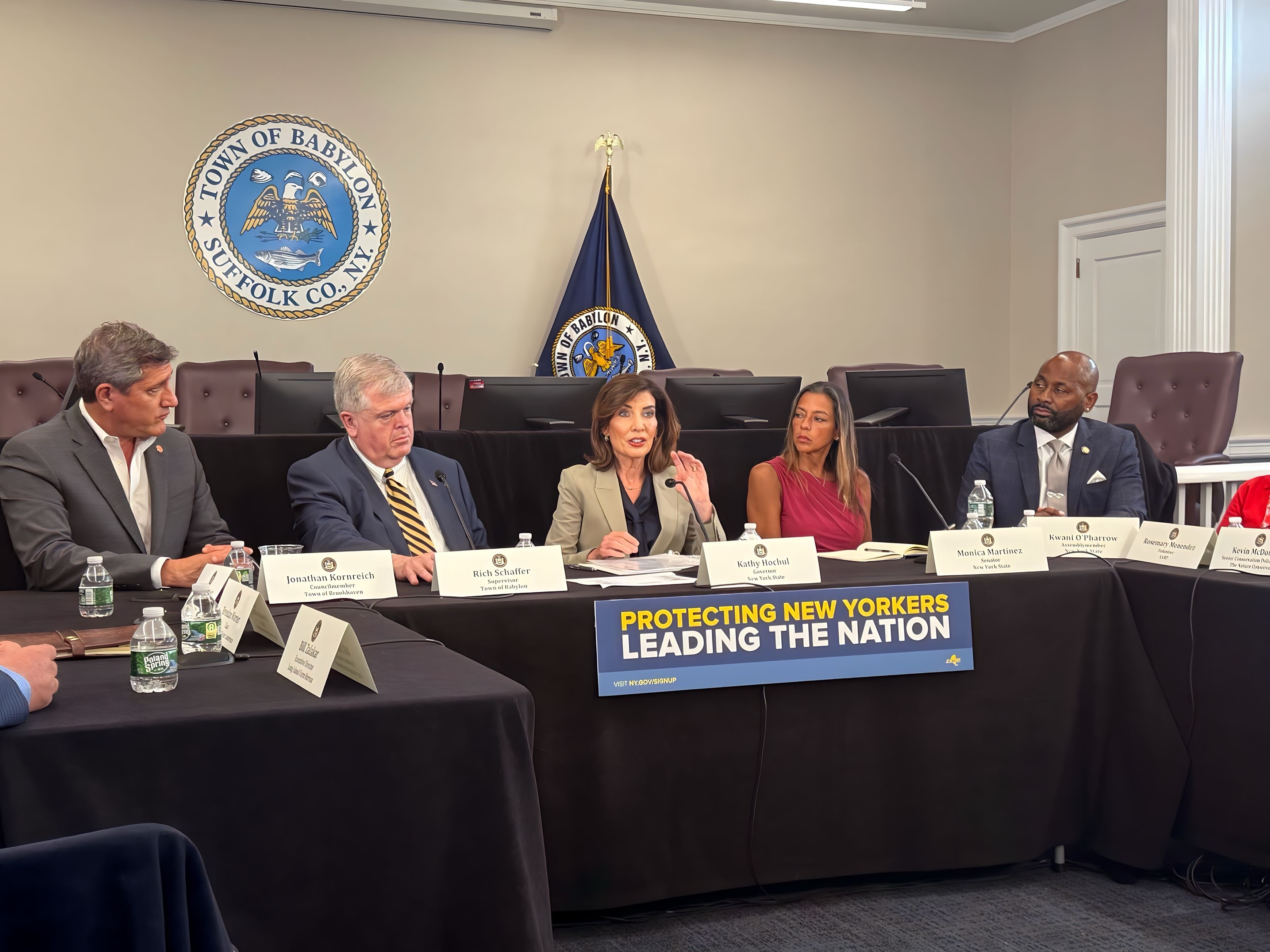 Photo image of Sen. Martinez seated to Gov. Hochul during a forum on data center development held on Long Island.