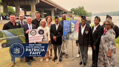 group photo in front of Patroon Island Bridge, soon to be Sgt. Henry Johnson bridge