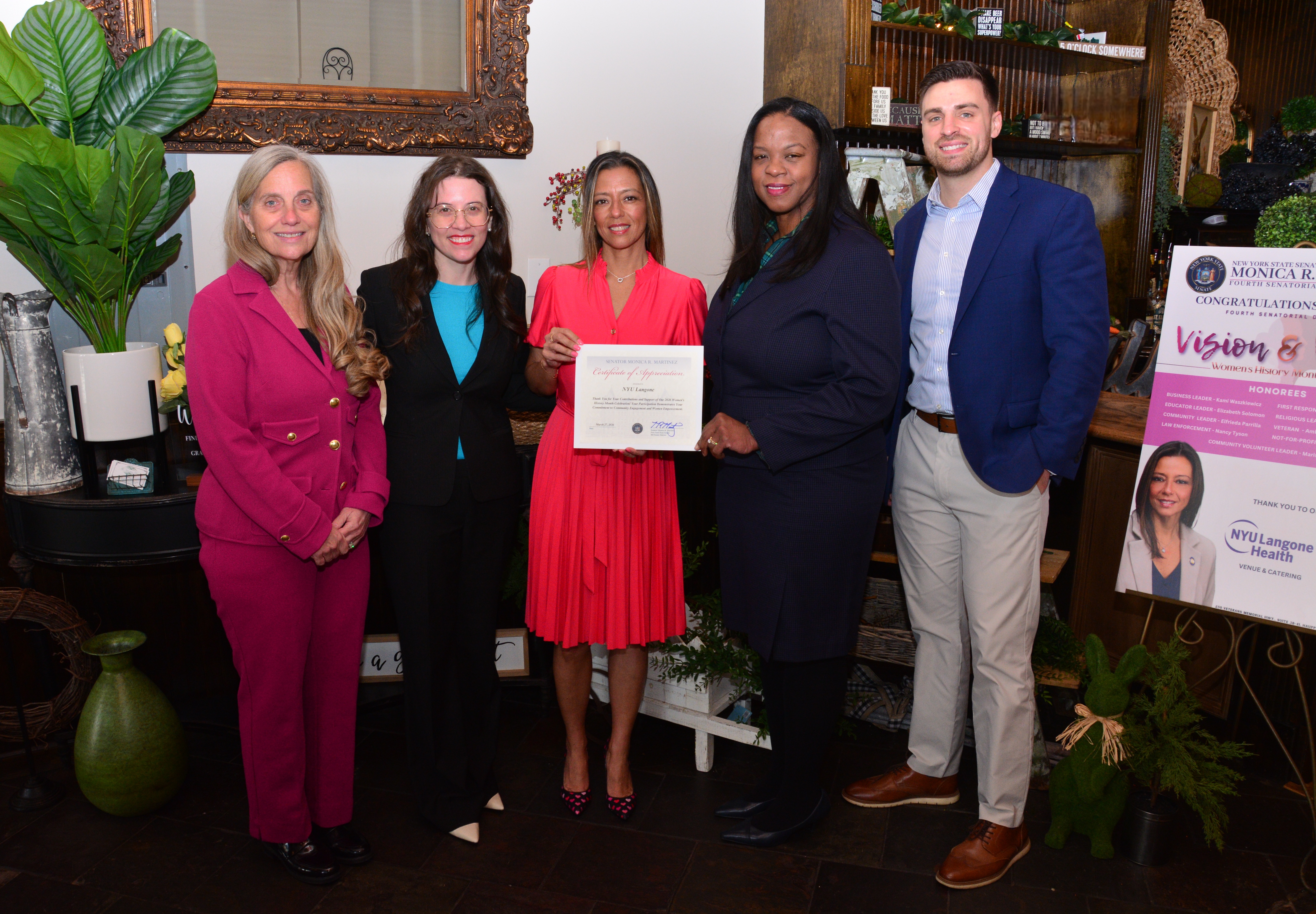 Photo image of Dr. Helen Pass, Dr. Maria Pere, State Sen. Monica R. Martinez, Dr. Camile A. Gooden, and Scott Janke during a ceremony honoring extraordinary female leaders from the Fourth Senatorial District.