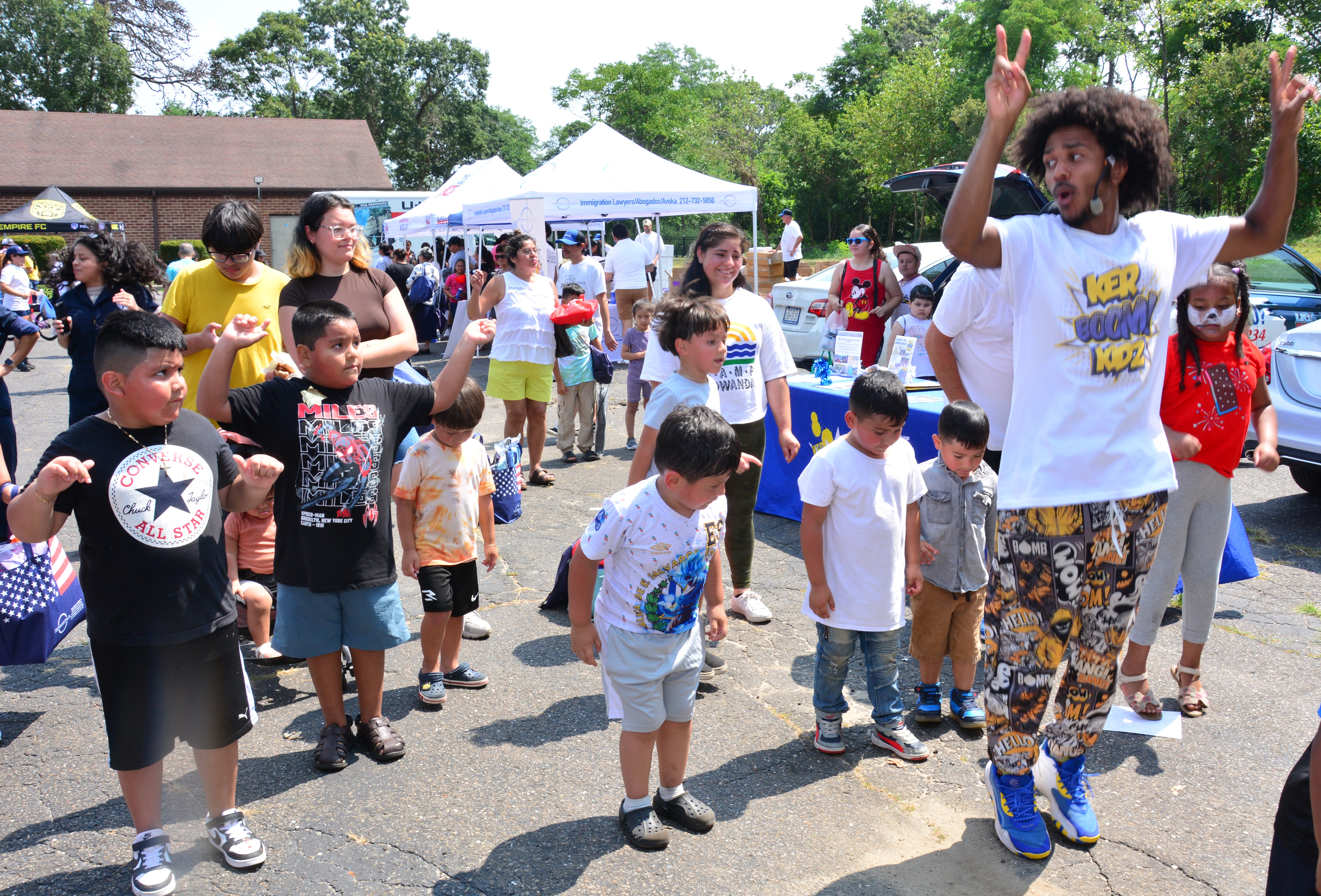 Children dance during a back-to-school supply distribution event held in Brentwood on Aug. 16, 2025.