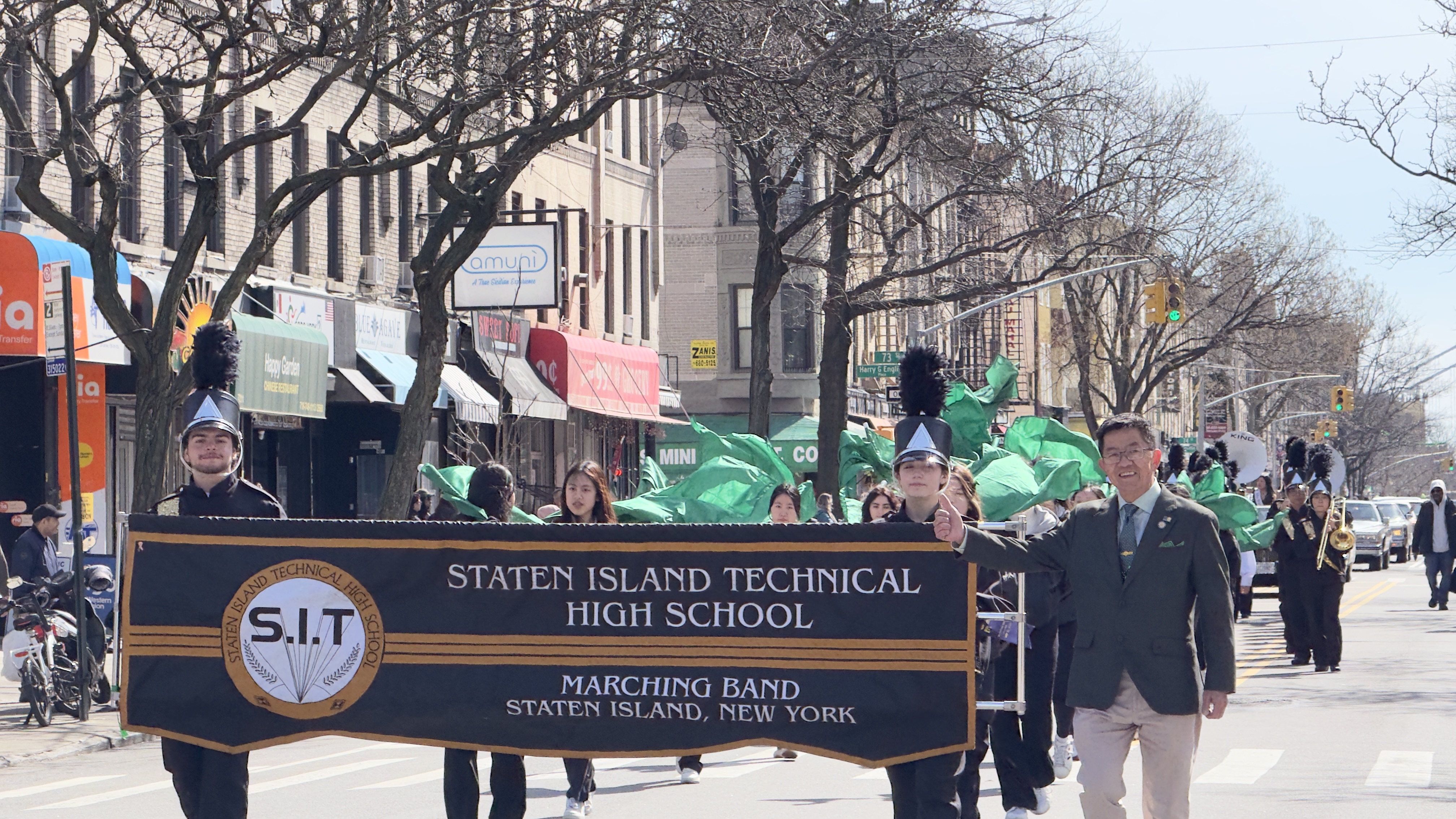 Senator Steve Chan marching with Staten Island Tech's Marching Band