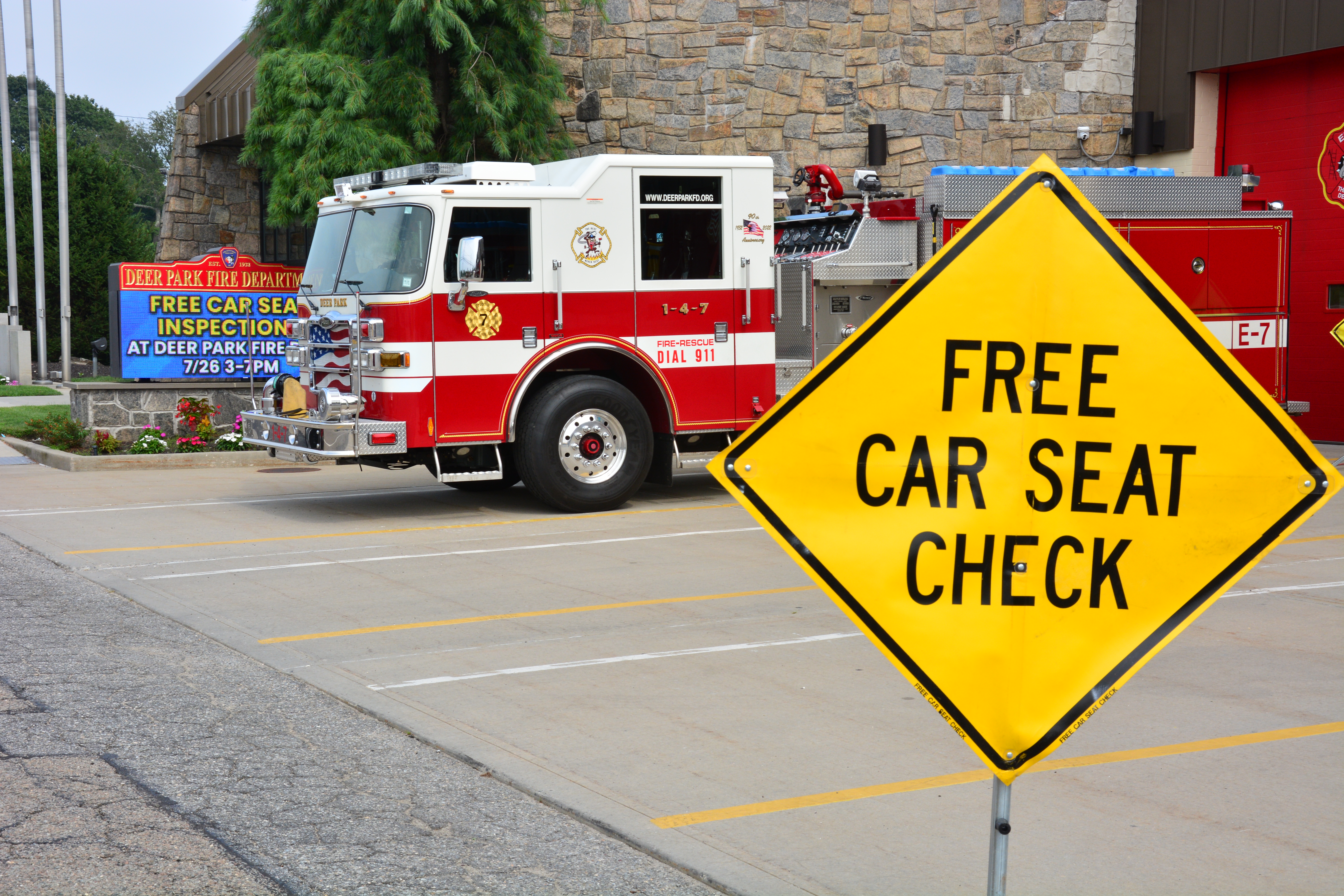 A sign outside the Deer Park Fire House on Lake Avenue announces a free car seat inspection event hosted by Sen. Monica R. Martinez on July 26, 2025.