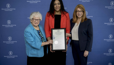 A photo of Senator Toby Ann Stavisky, Assemblymember Linda B. Rosenthal, and Dr. Cardinale Smith (Chief Medical Officer), holding the signed pen certificate of the Scalp Cooling Insurance Law