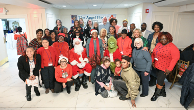 Senator Stewart-Cousins with Santa, the Grinch, Angels and Grandparents