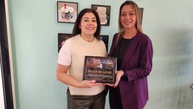Photo (left to right): Mabel Perfecto, owner of Dulce de Leche Bakery, receives an Empire Award from State Sen. Monica R. Martinez.