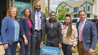 New York State Senator Monica R. Martinez stands with elected officials and family members of a slain CVS Worker during a press conference calling for the passage of the Edeedson Ciné, Jr. Transparency Act