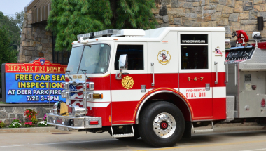Photo of a Deer Park Fire Department Firetruck parked in front of the Deer Park Fire Department