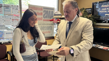 Senator Addabbo presents a scholarship check to Emma Fernandez.