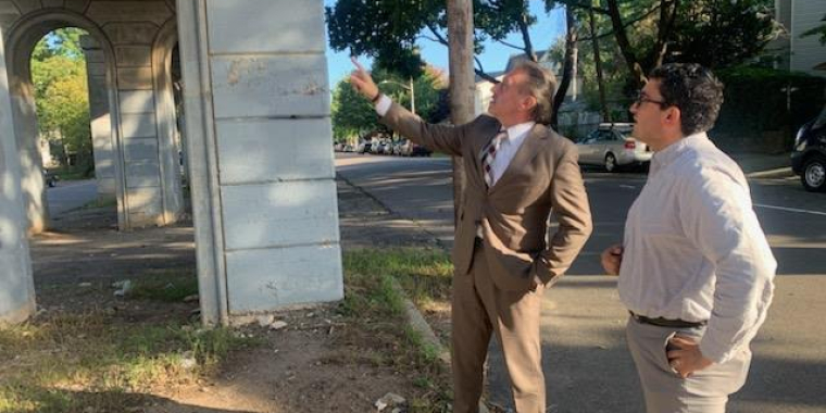 Senator Joseph P. Addabbo, Jr. and his Chief of Staff, Raimondo Graziano examine the Babbage & Bessemer Street train trestle.