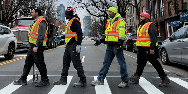 NYC DOT employees at a new mid-block crossing on Atlantic Avenue