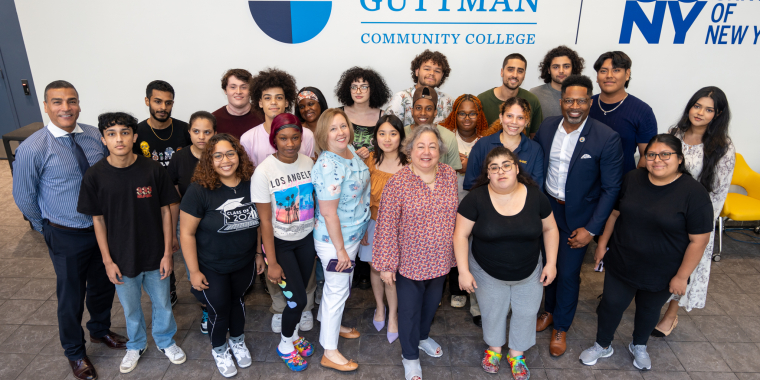 Senator Krueger stands with students from Guttman Community College