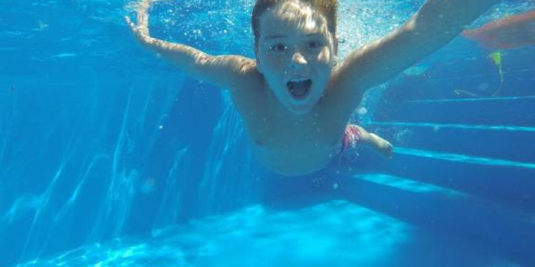 Kid swimming in pool