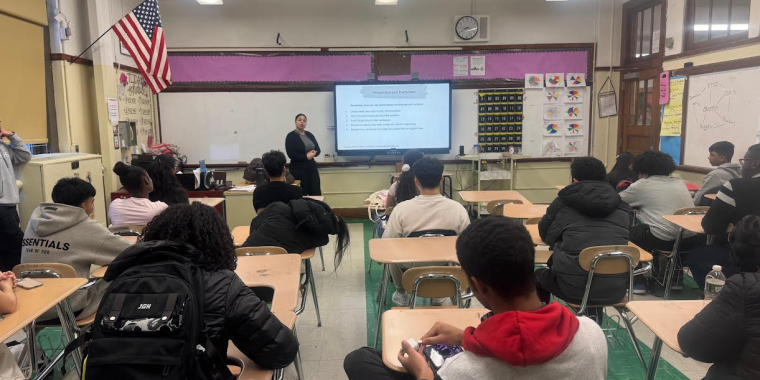 Aimer Torres, a community educator with Day One, speaks with students about healthy relationships.