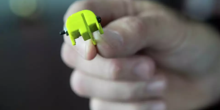 A 3D-printed "Glock switch" is seen in Houston in 2022. The device can convert a semi-automatic firearm into a machine gun. 