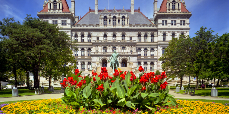 The New York State Capitol with spring flowers in the foreground