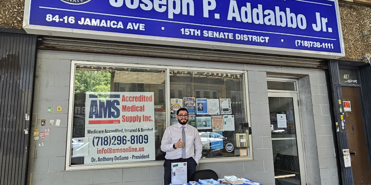 Raimondo Graziano, Addabbo’s Chief of Staff, stands outside the senator’s office in Woodhaven to provide resources to passersby. 