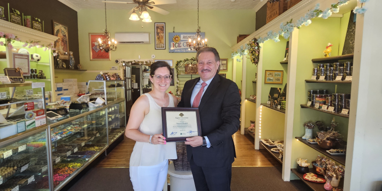 Senator Addabbo commends Rachel Kellner, owner of Aigner Chocolates.
