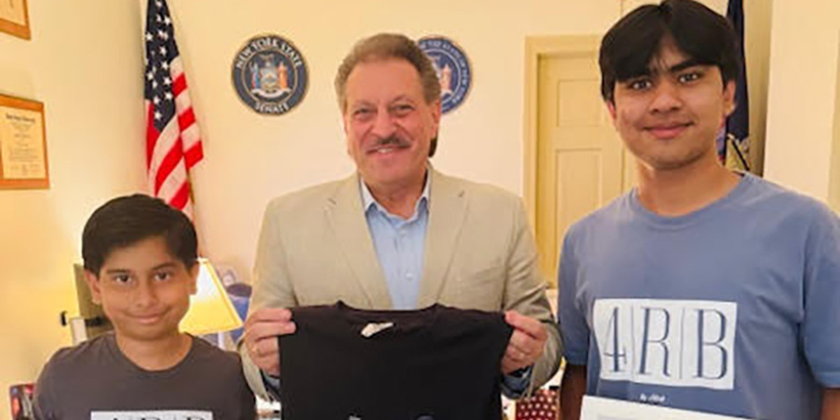 Senator Addabbo presents citations to Adeeb and Naveed Razzaque.