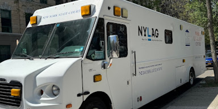 The New York Legal Assistance Group’s Mobile Legal Help Center outside the district office