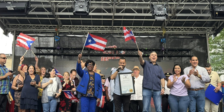 Senator Serrano presenting a Senate Proclamation at the 40th Annual 116th Street Festival