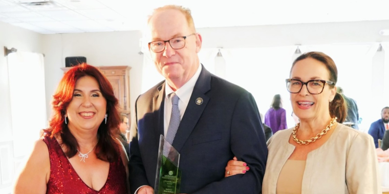 Senator Rolison accepting CP Unlimted award