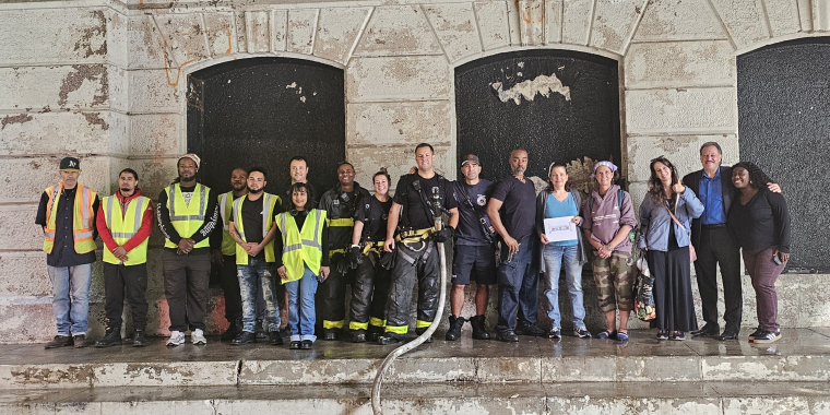 It took a team effort to prep the area for the forthcoming mural.