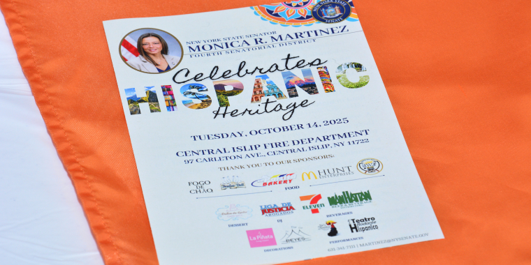 Image of a Hispanic Heritage Month Celebration Event Program placed onto a table at the event.