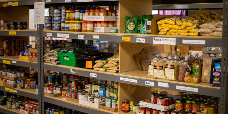 Photo of food pantry shelf with food items on it.