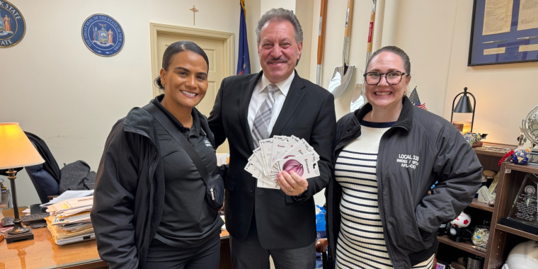 Senator Joseph P. Addabbo, Jr. receives gift cards from the community from Local 338 RWDSU Representatives.