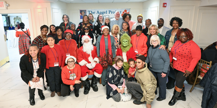 Senator Stewart-Cousins with Santa, the Grinch, Angels and Grandparents
