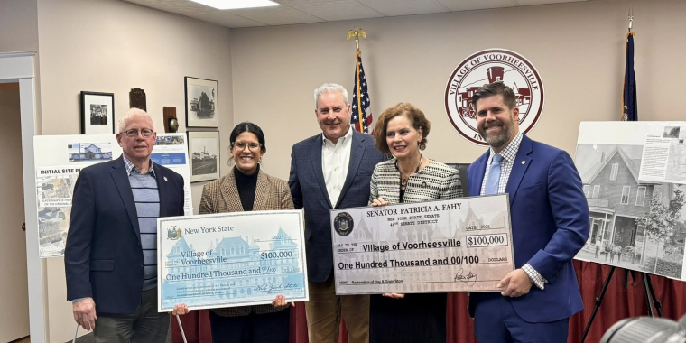 AM Romero, Sen. Fahy, with Voorheesville elected officials presenting checks for $200,000