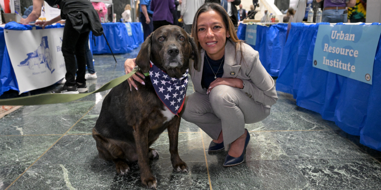 Senator Martinez poses with a dog during Animal Advocacy Day in Albany, NY