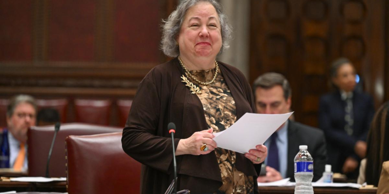 Senator Krueger smiles on the Senate floor during debate