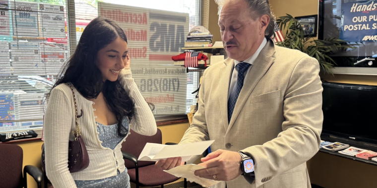 Senator Addabbo presents a scholarship check to Emma Fernandez.