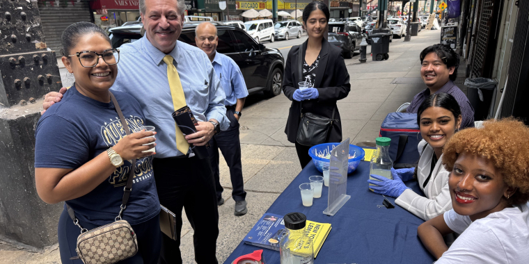 Senator Addabbo greets constituents with a free cup of lemonade.