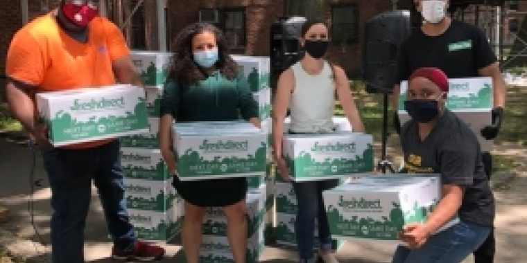 Senator Biaggi poses with fellow volunteers to distribute groceries 