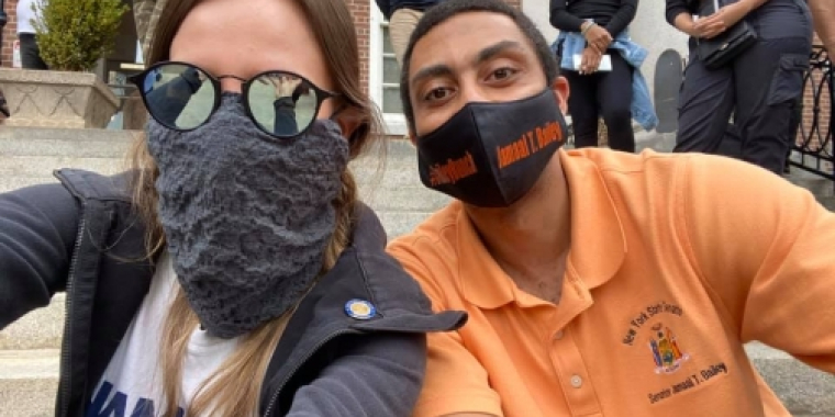 Senator Biaggi takes a selfie with a fellow protester 