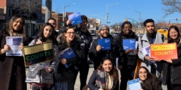 Senator Biaggi and a group of volunteers pose for a photo 