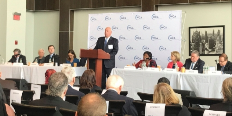 An attendee speaks to the audience 