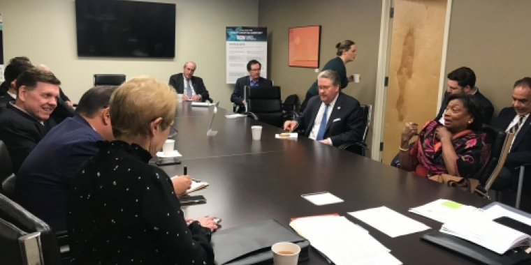 Attendees of the meeting discuss various issues 