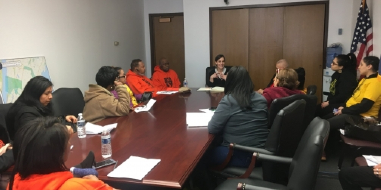 Senator Biaggi sits down with members at the meeting
