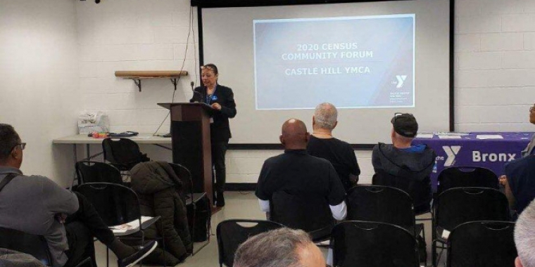 A Castle Hill YMCA employee delivers a presentation on the Census count