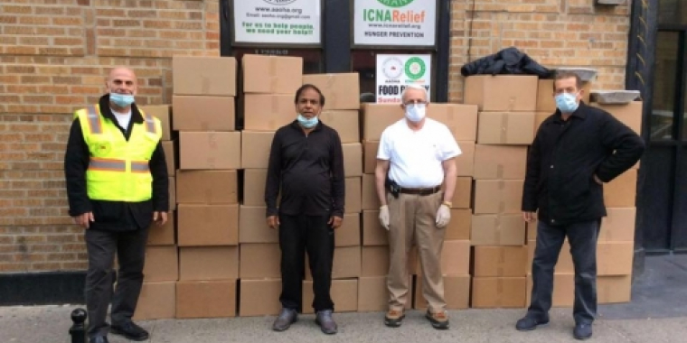 Representatives from Rethink Food NYC, Otto Brehm Inc INCA Relief & Albanian American Open Hang Association Inc. stand by packages of meals